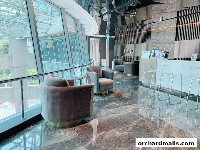 Interior of a modern beauty clinic with plush seating and a reception area.