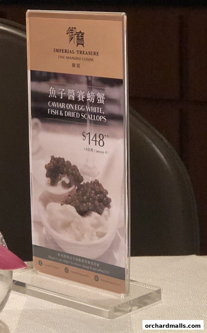 A menu display for Imperial Treasure Fine Shanghai Cuisine featuring caviar on egg white, fish & dried scallops.