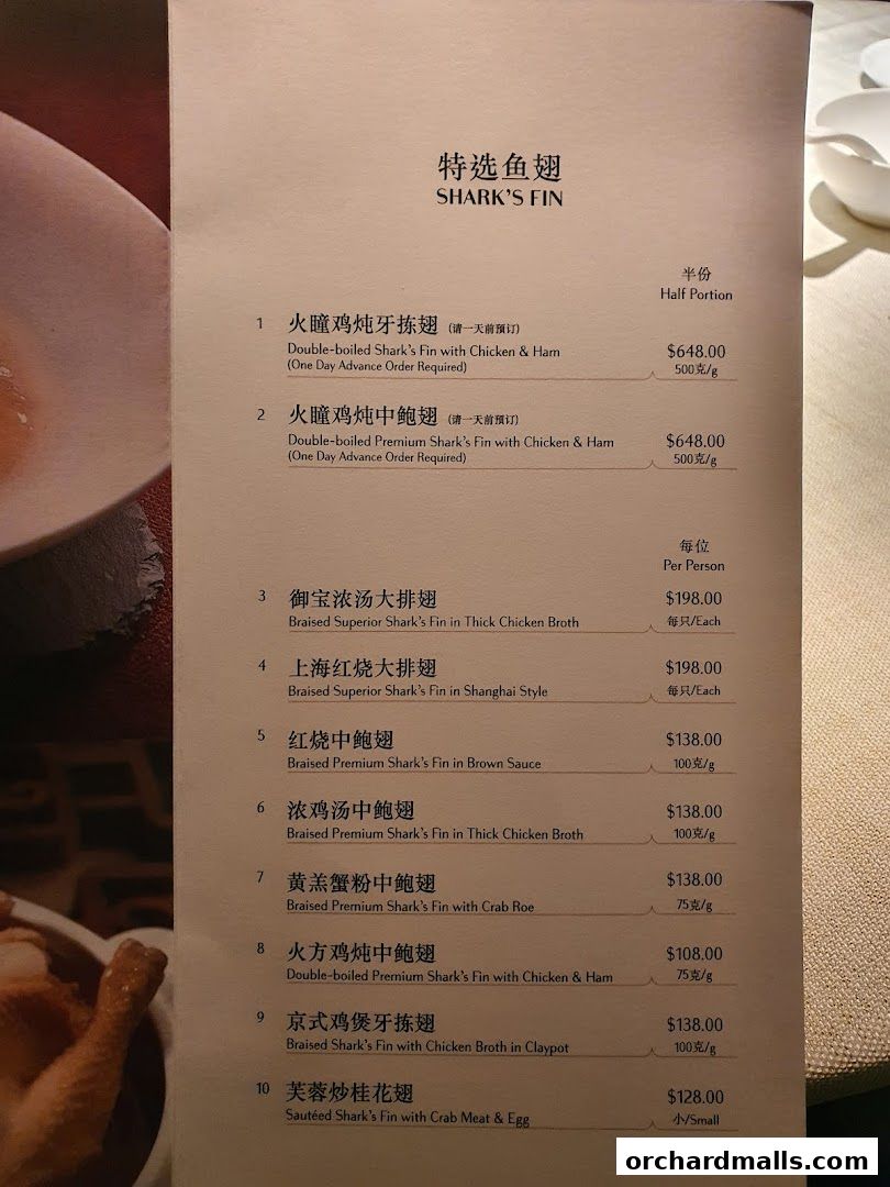 A menu page featuring premium shark's fin dishes with prices and descriptions.