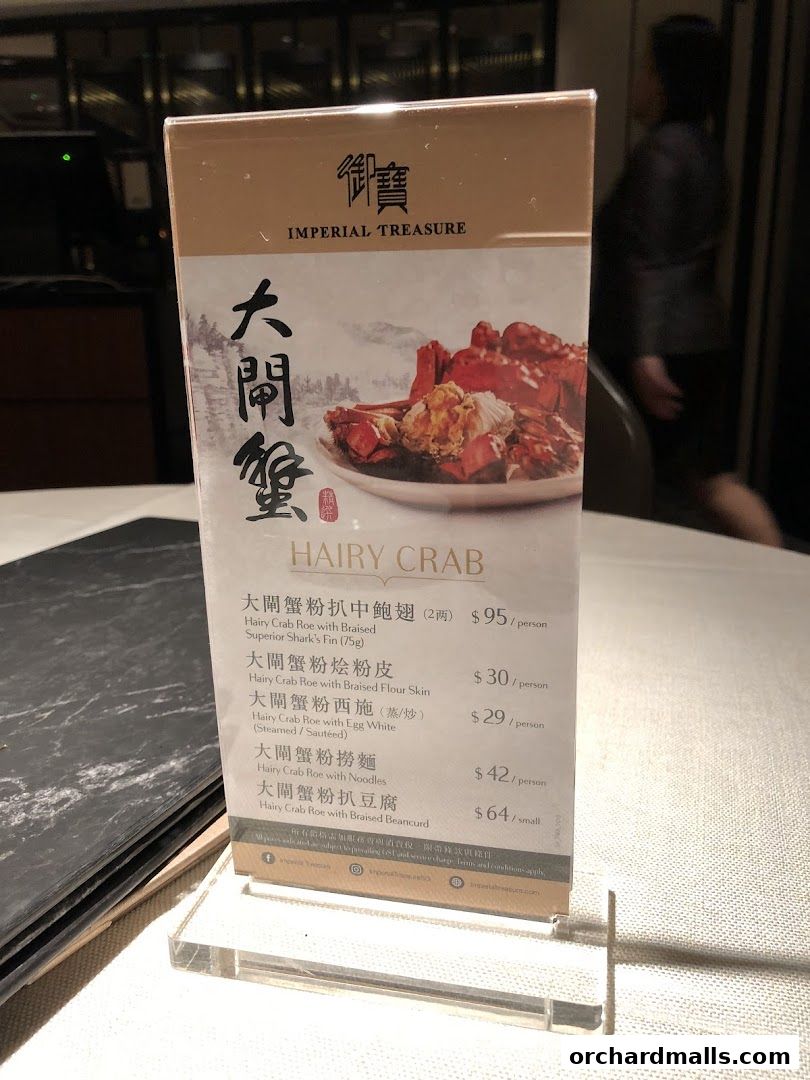 A menu display for Imperial Treasure Fine Shanghai Cuisine featuring Hairy Crab dishes.