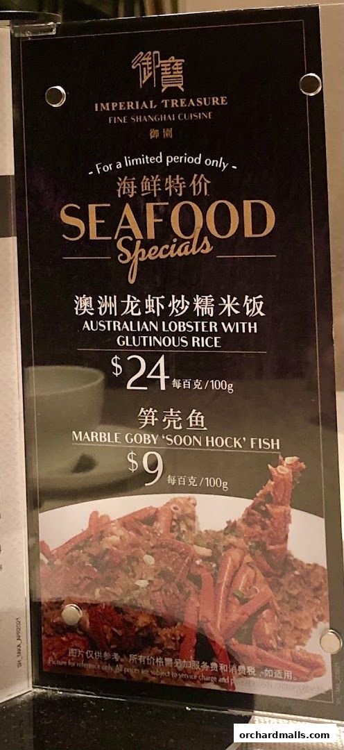 A menu board for Imperial Treasure Fine Shanghai Cuisine featuring seafood specials.