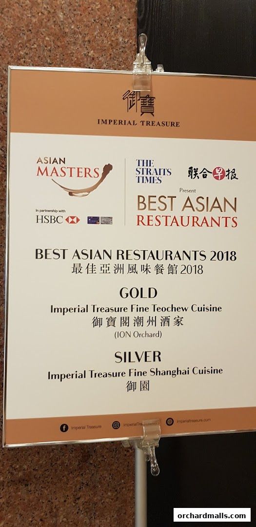 A sign announcing Imperial Treasure Fine Shanghai Cuisine as a Silver award winner in Best Asian Restaurants 2018.