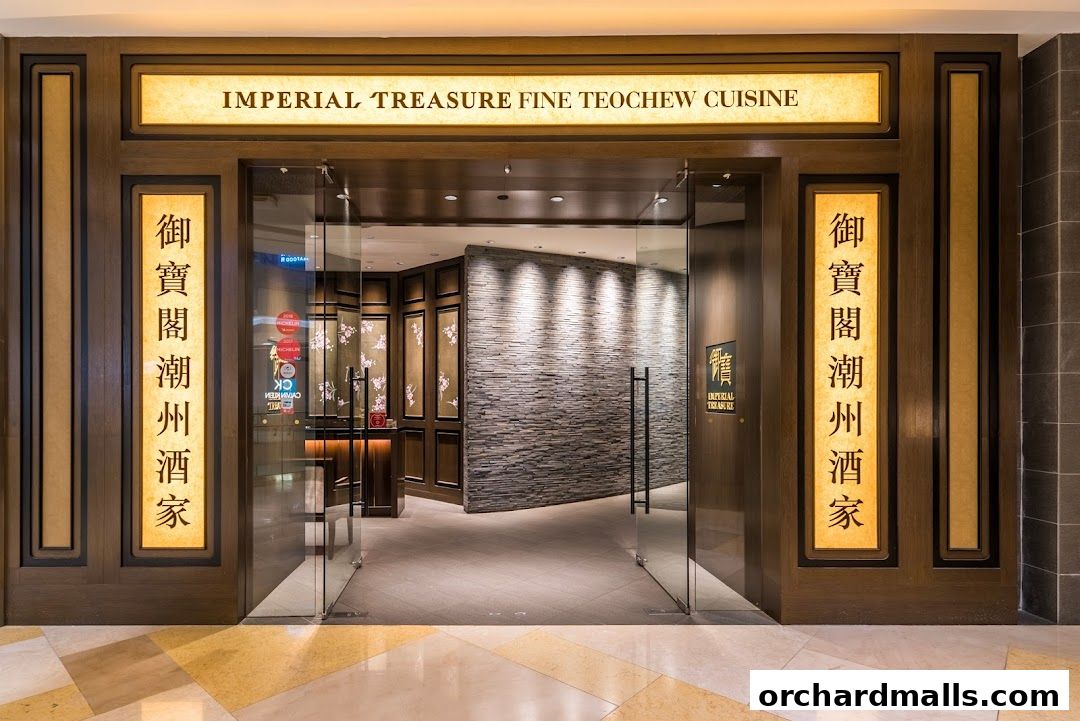 The elegant entrance to Imperial Treasure Fine Teochew Cuisine, featuring ornate signage and glass doors.