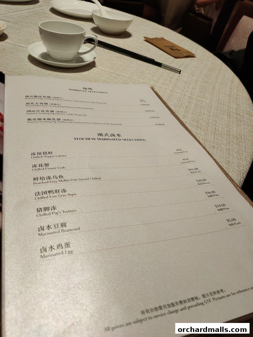 A menu from Imperial Treasure Fine Teochew Cuisine featuring barbecue and marinated selections.