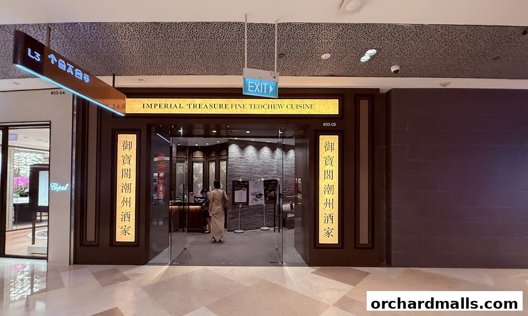 The entrance to Imperial Treasure Fine Teochew Cuisine, a restaurant with elegant signage and glass doors.