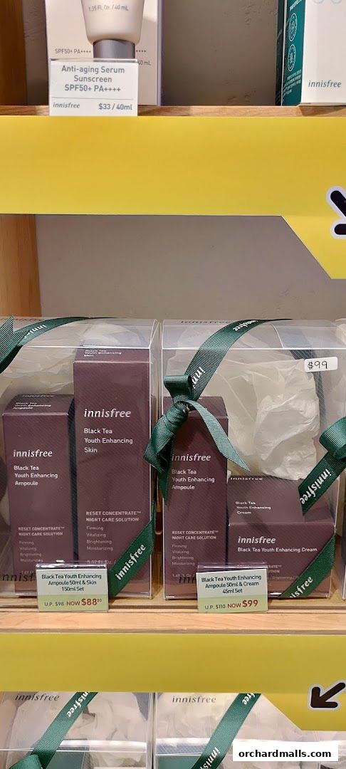 Innisfree Black Tea Youth Enhancing products displayed on shelves with pricing.