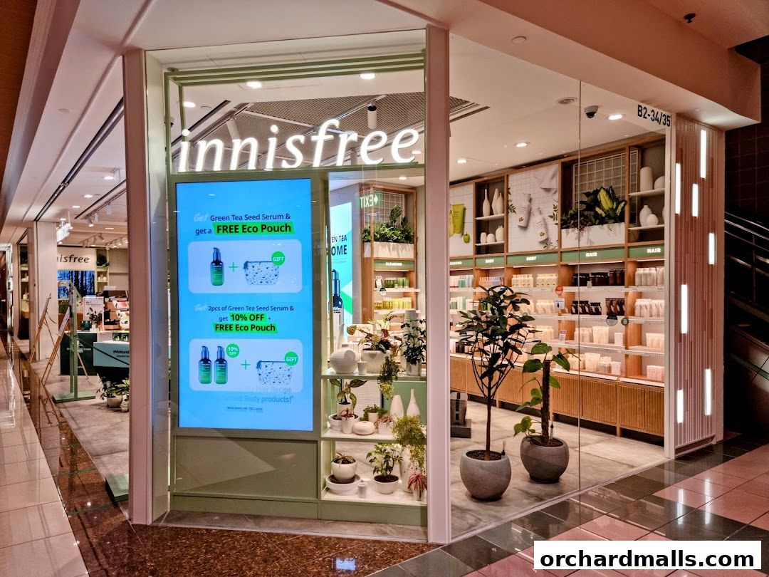 Innisfree store front with promotional display and shelves stocked with beauty products.
