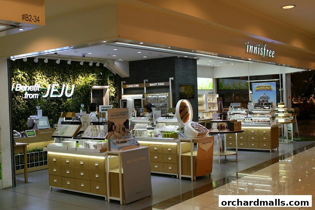 Innisfree store interior showcasing skincare and beauty products with a green wall.