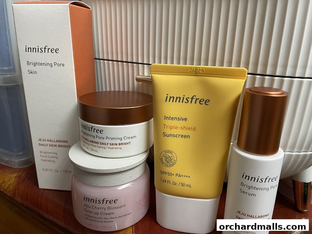 A collection of Innisfree skincare products, including serum, cream, and sunscreen.