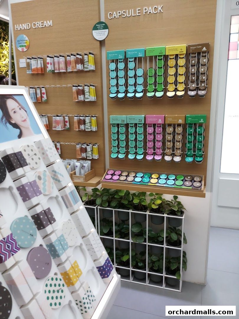 Innisfree shop display featuring hand creams and capsule packs with plants.