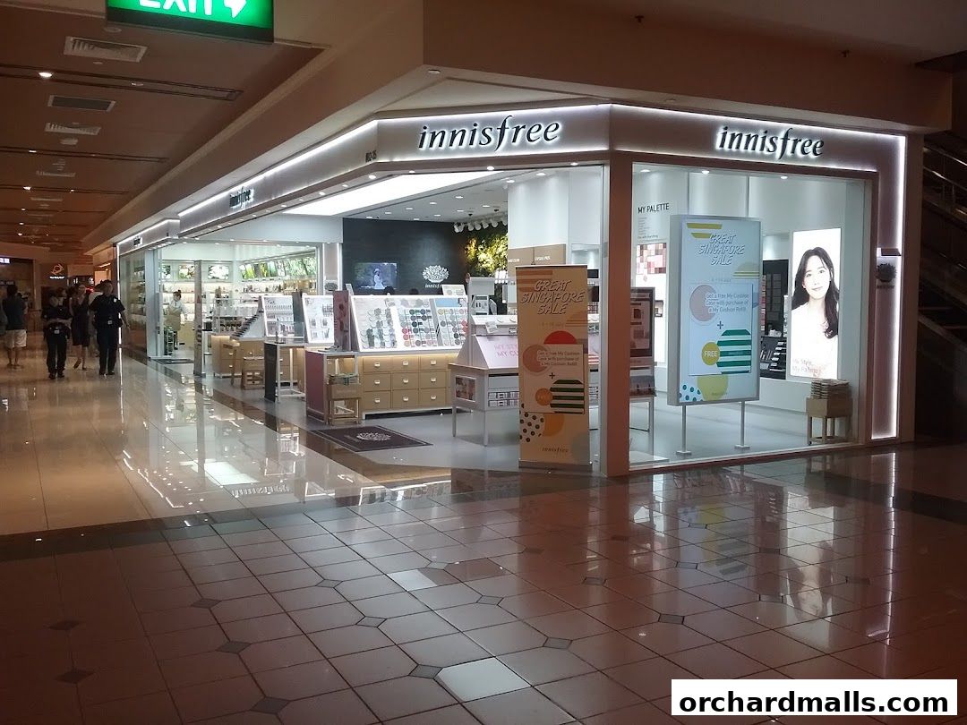 Innisfree store entrance with displays of beauty products and promotional signage.