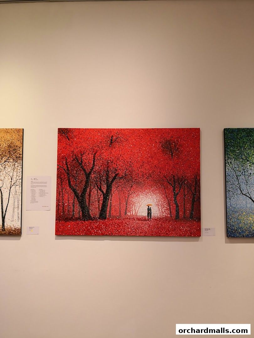 Artwork featuring a couple walking under an umbrella in a vibrant red forest.