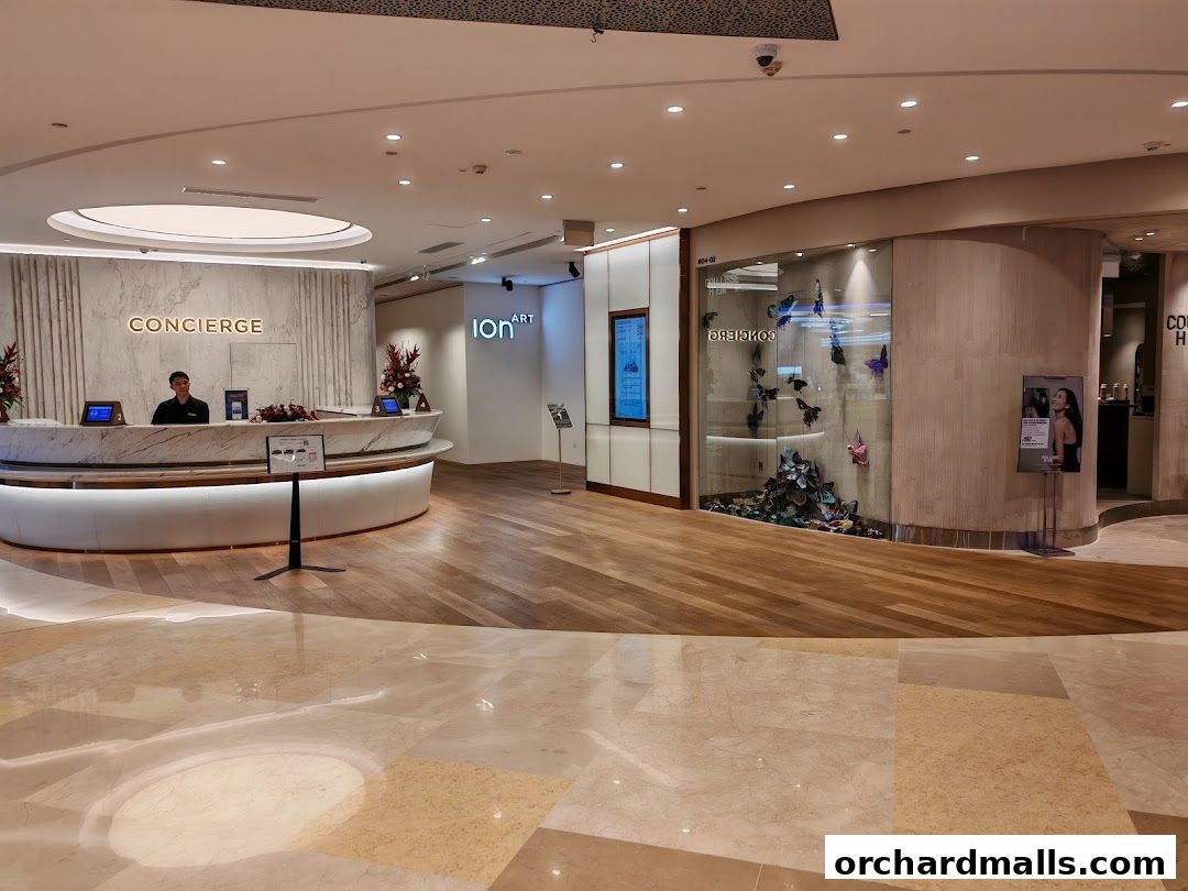 ION Sky concierge desk and an art display with butterflies.