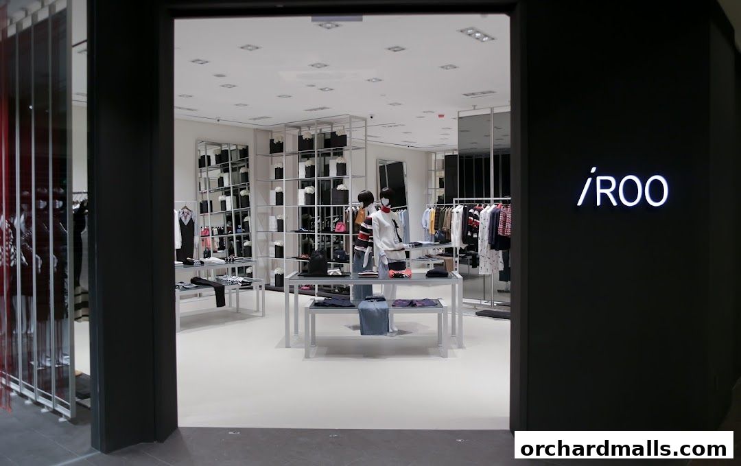 Entrance to the iROO Ngee Ann City fashion store, showcasing apparel displays.