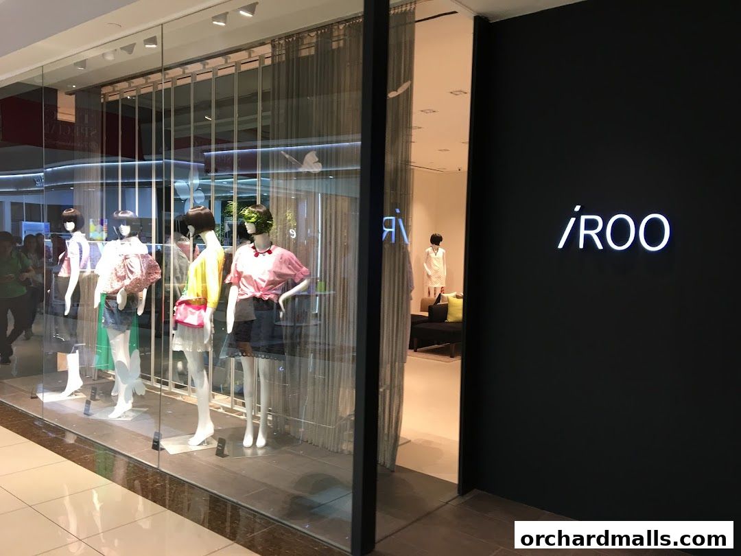 The storefront of iROO Ngee Ann City features mannequins displaying fashionable outfits.