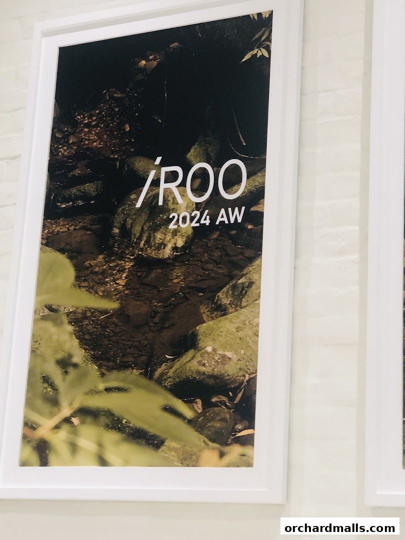 Framed artwork displaying the brand name '/ROO' and '2024 AW'.