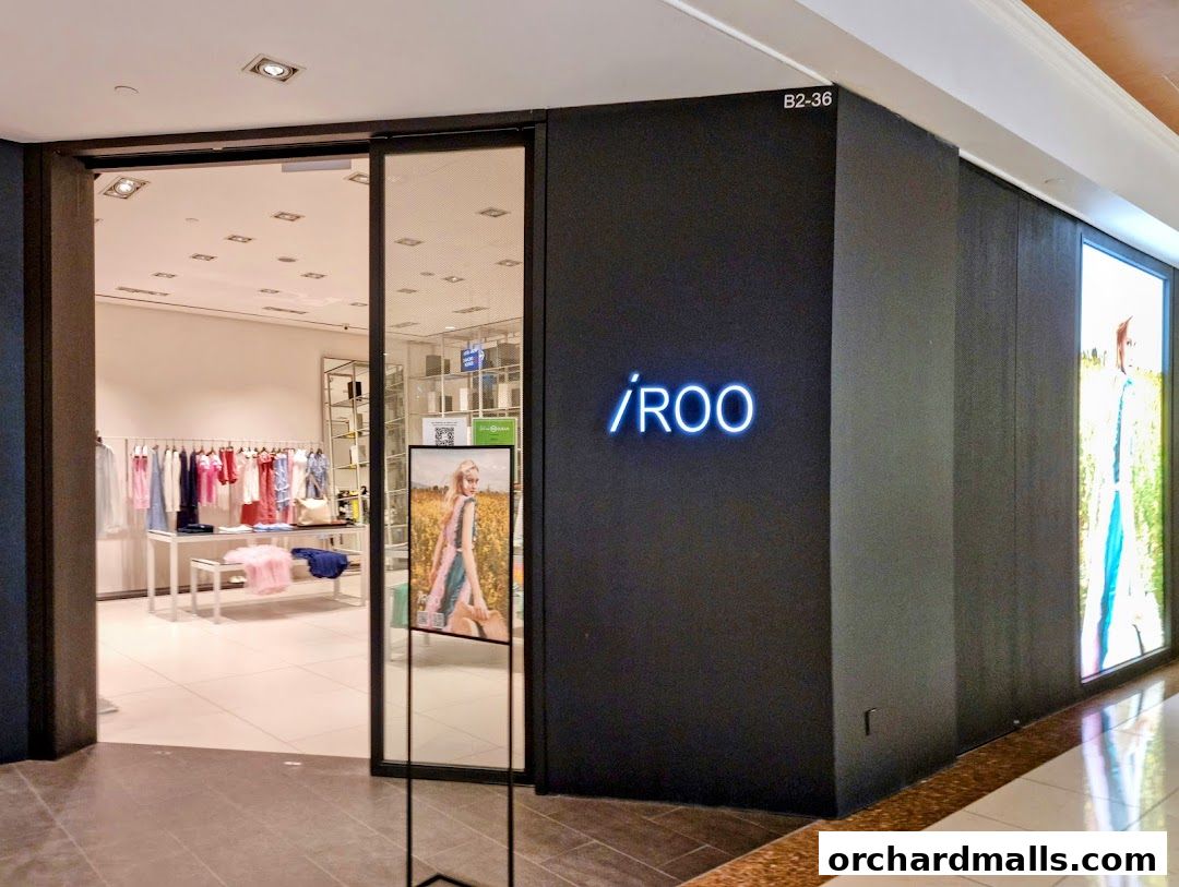The entrance of the iROO fashion store at Ngee Ann City, showcasing clothing displays.