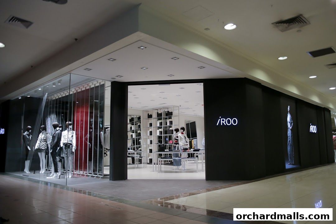 The modern storefront of iROO Ngee Ann City, showcasing mannequins and interior displays.