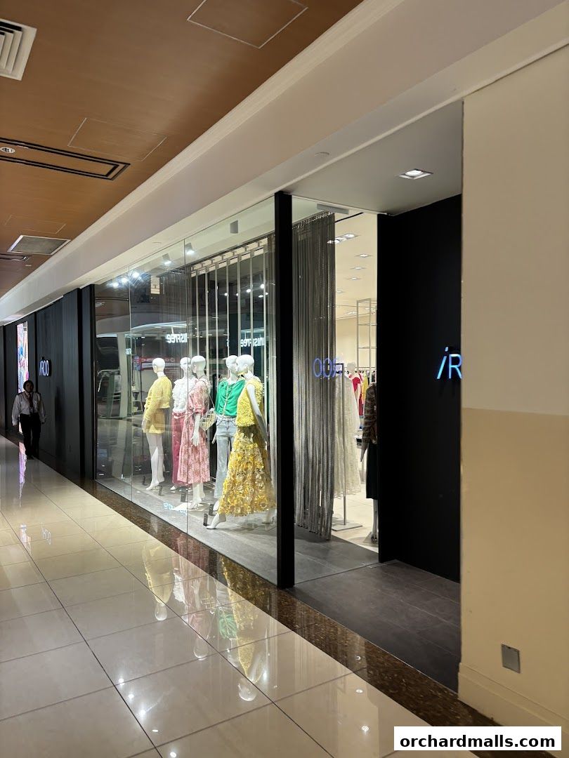 The storefront of iROO Ngee Ann City, featuring mannequins in colorful outfits.