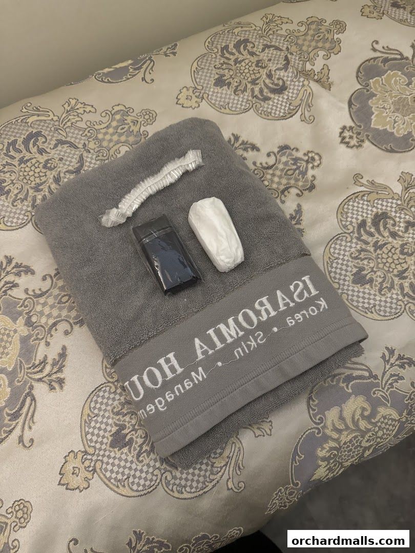 Aesthetic treatment essentials: towel, shower cap, and product samples.