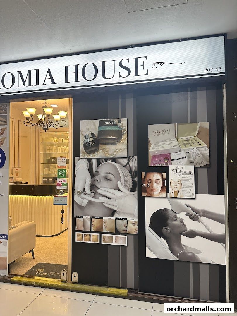 Exterior of Isaromia House, an aesthetics clinic, showcasing treatments and products.