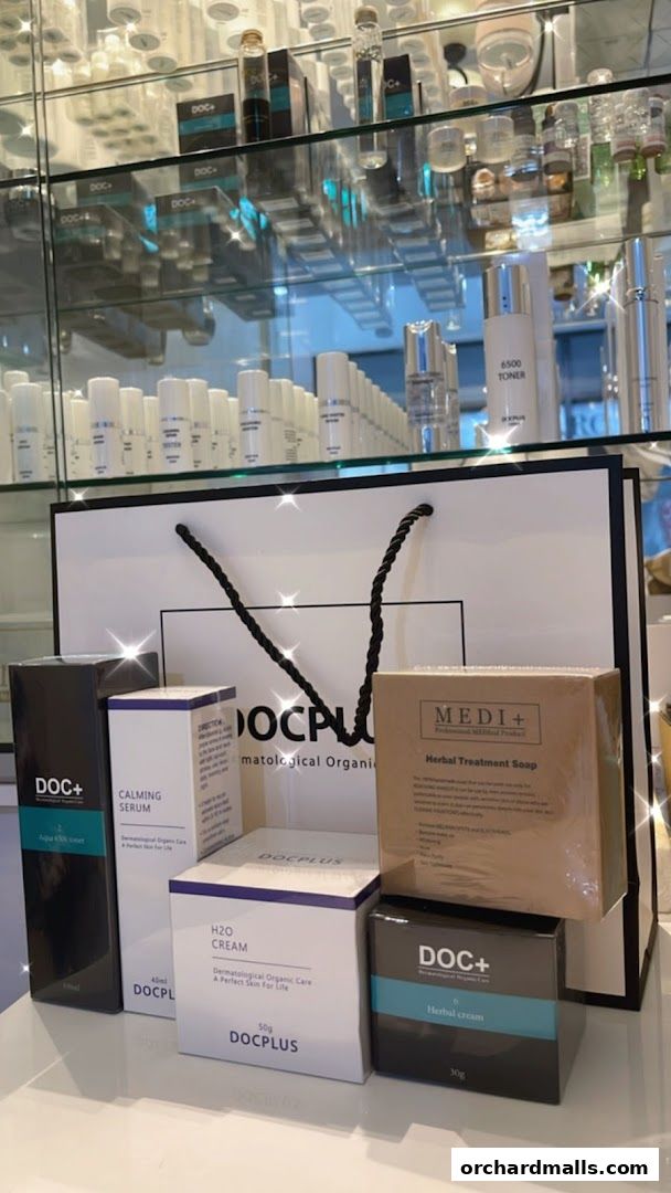A display of various skincare products from DOC+ and MEDI+ brands, including creams, serums, and soaps.