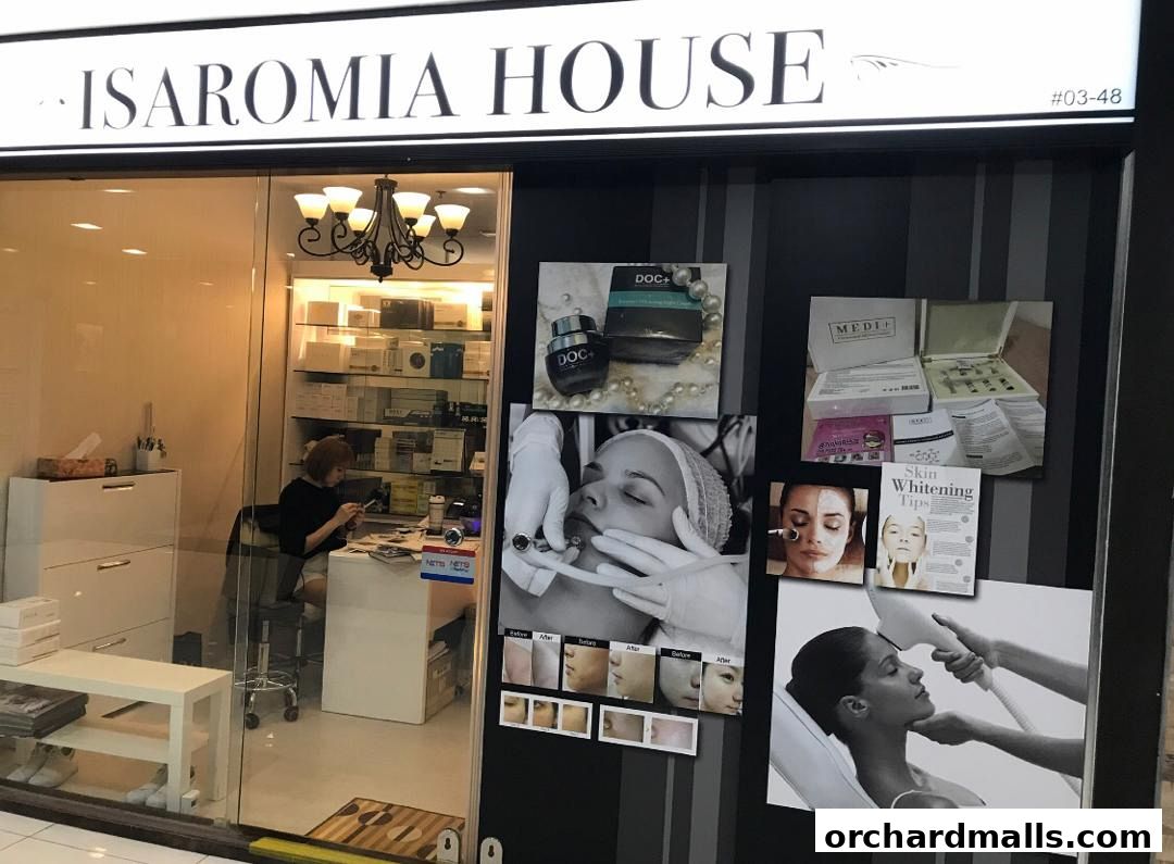 Exterior of Isaromia House, an aesthetics clinic with products and treatment images displayed.