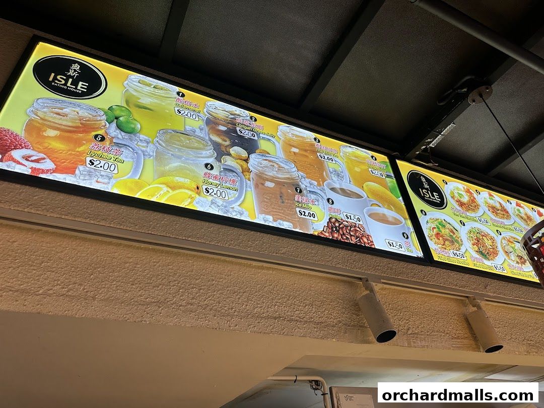 A brightly lit menu board displaying various drinks and food items from Isle Eating House.