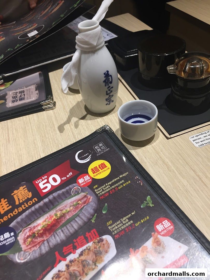 A close-up of a menu at Itacho Sushi, featuring special offers and sushi items.
