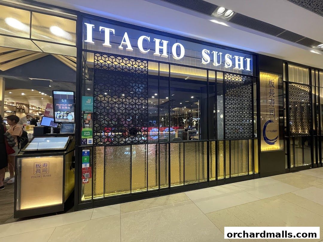 The exterior of Itacho Sushi, a Japanese restaurant, with its illuminated signage and modern facade.