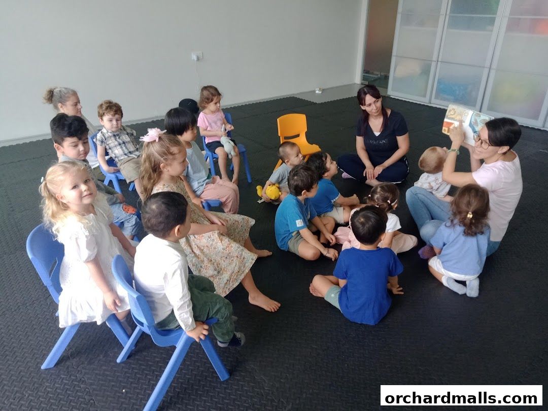 Children and adults gathered for a story time session in a bright, modern room.