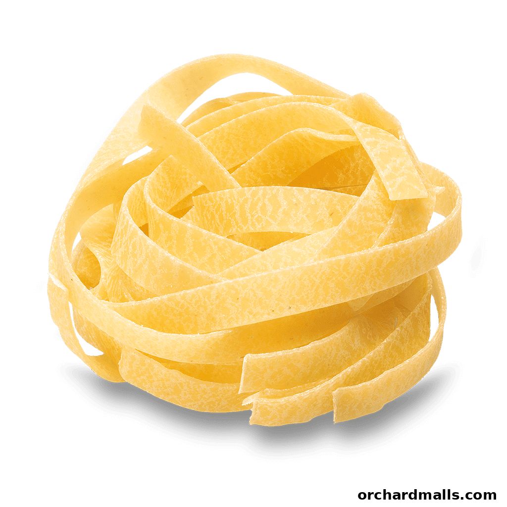 A nest of fresh, golden fettuccine pasta on a dark green background.
