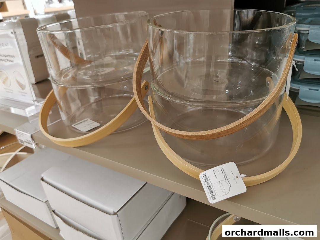 Glass buckets with wooden handles displayed on a shelf at IUIGA.