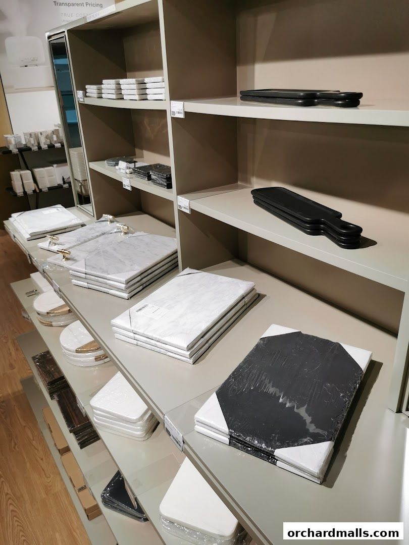 Shelves displaying various kitchenware and home decor items, including cutting boards and serving platters.