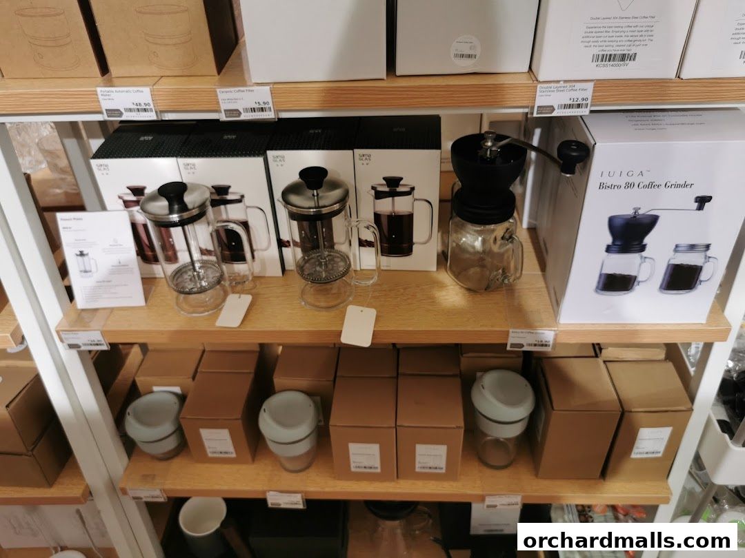 Shelves display coffee makers, grinders, and other kitchenware from IUIGA.