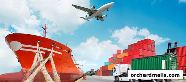 A cargo ship, airplane, truck, and shipping containers at a port.
