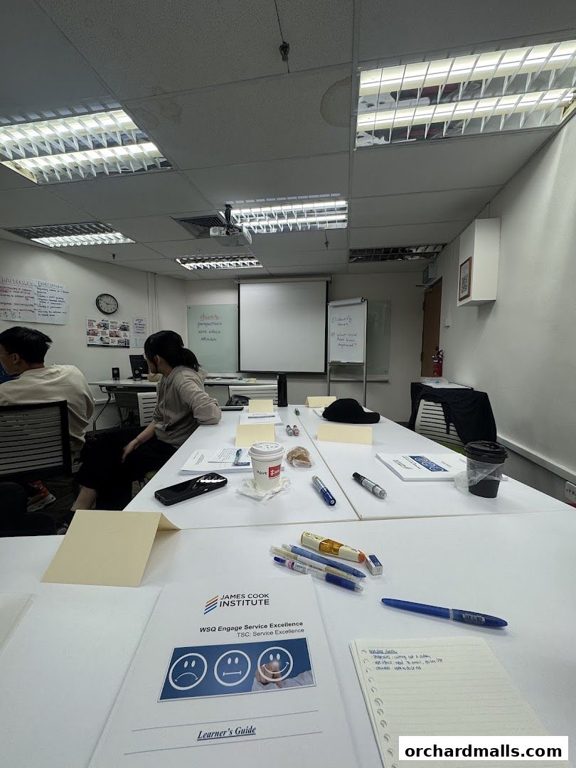 A classroom setting with students and learning materials on tables.