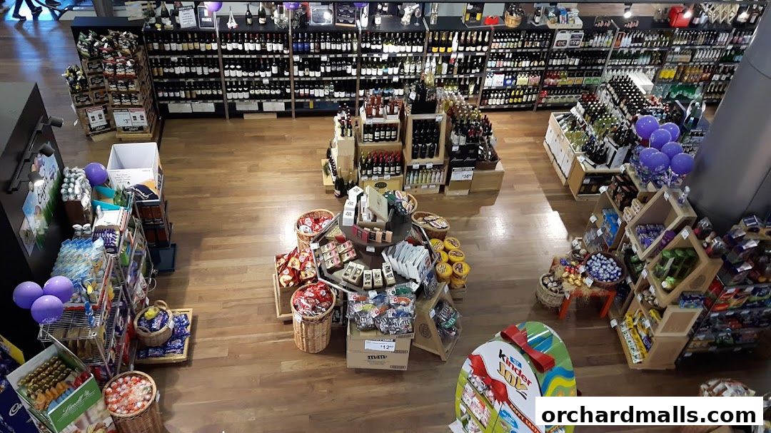 An overhead view of a well-stocked deli and wine shop with various products displayed.