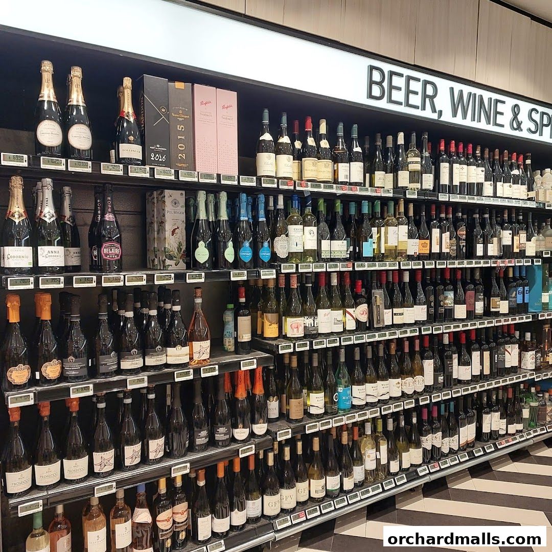 Shelves stocked with a wide variety of wine, champagne, and spirits.
