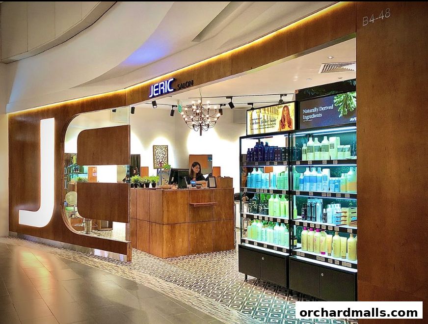 The entrance of JERIC SALON, featuring a reception desk and shelves stocked with hair products.