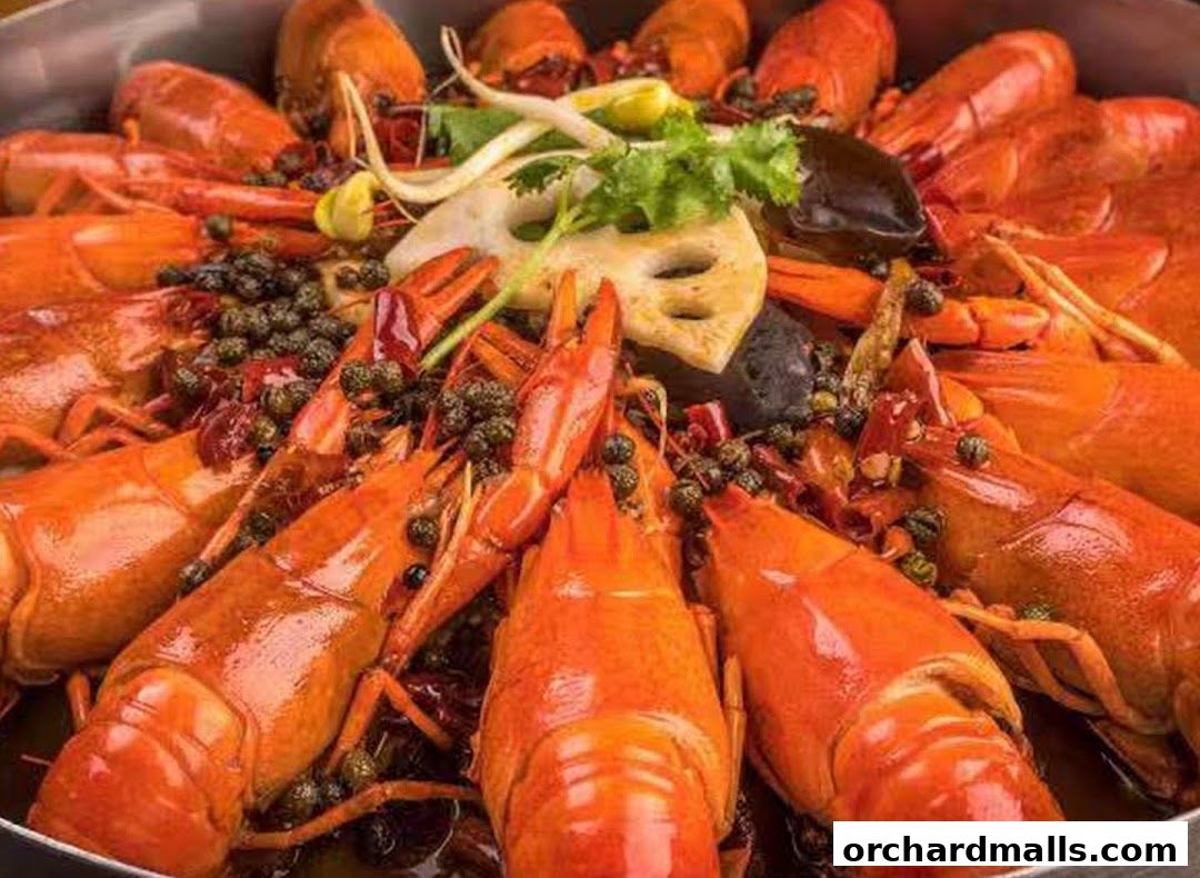 A close-up shot of a large platter filled with cooked crawfish, garnished with spices and vegetables.