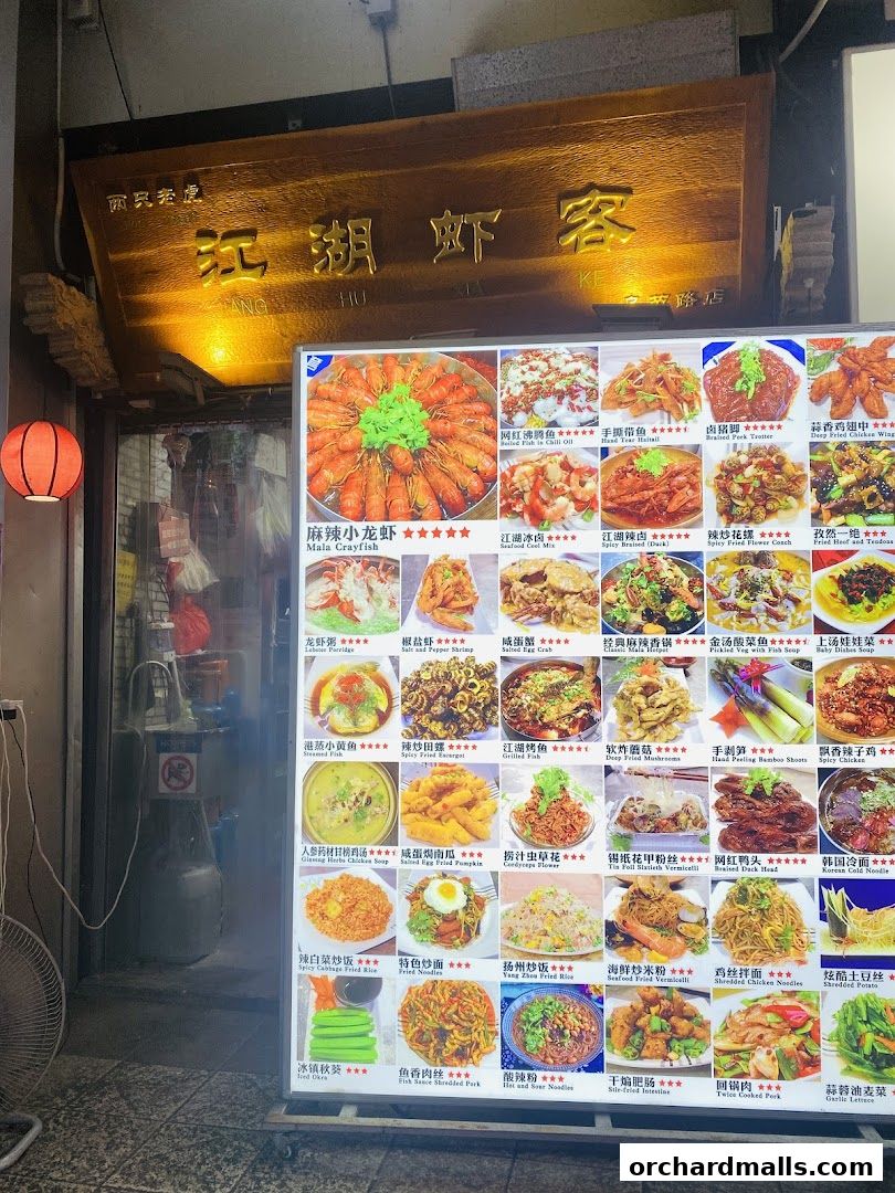A brightly lit menu board displays a variety of Chinese dishes with enticing images.