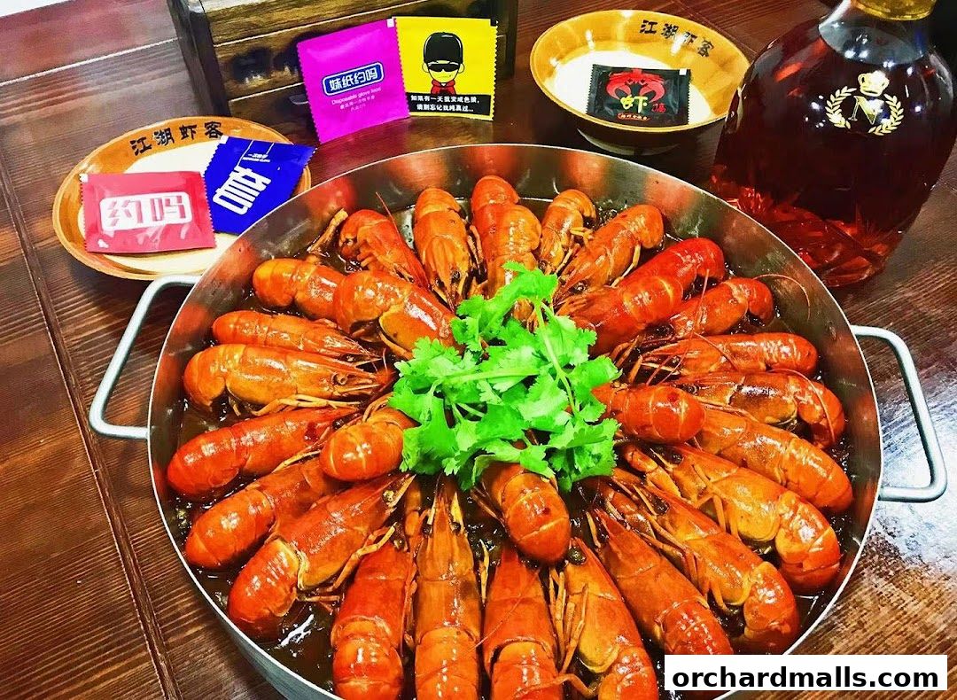 A large platter of cooked crawfish is served with garnishes and condiments.