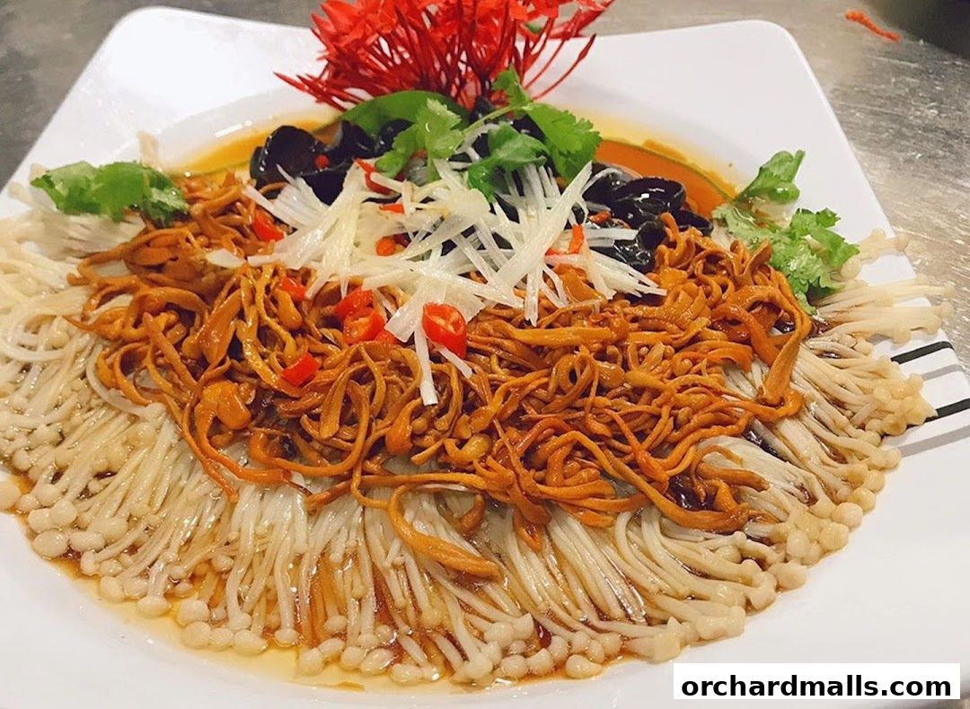 A close-up of a delicious dish featuring enoki mushrooms, cordyceps, and chili peppers.