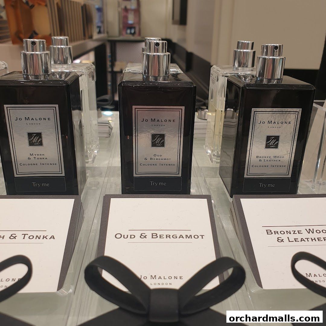 Jo Malone London cologne bottles displayed with scent cards and 'Try me' labels.
