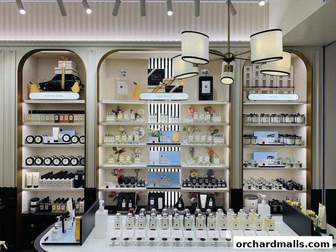 Interior view of a Jo Malone London shop showcasing perfumes, candles, and bath products.