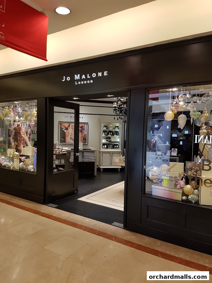 The elegant storefront of Jo Malone London, showcasing perfumes and gift sets.
