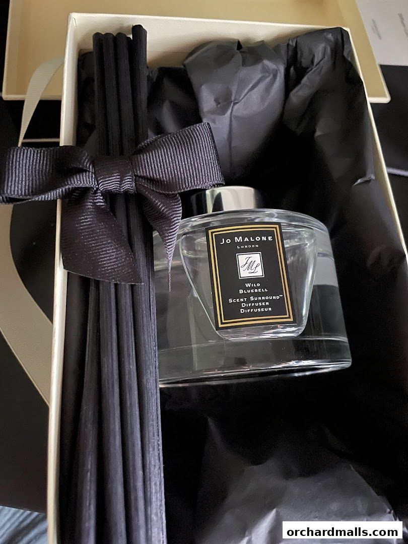 A Jo Malone London Wild Bluebell Scent Surround Diffuser gift set with black reeds and ribbon.