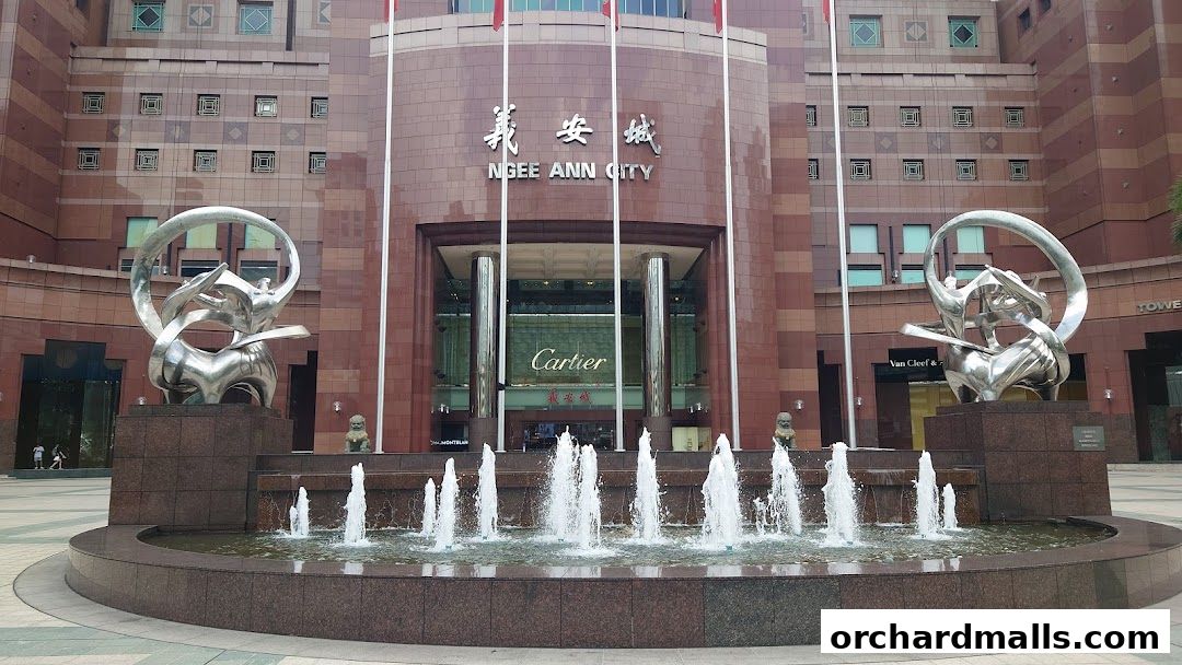 Ngee Ann City building entrance with fountains and sculptures.