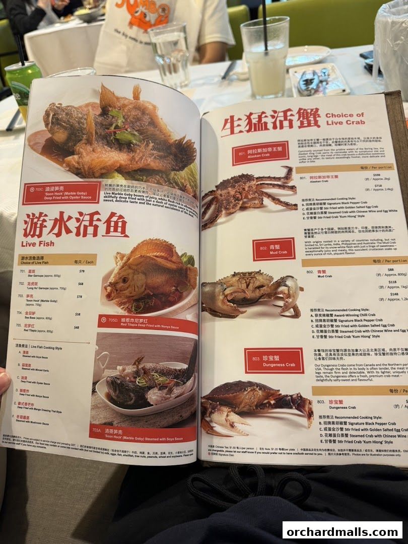 A menu from JUMBO Seafood featuring live fish and crab dishes with prices and descriptions.